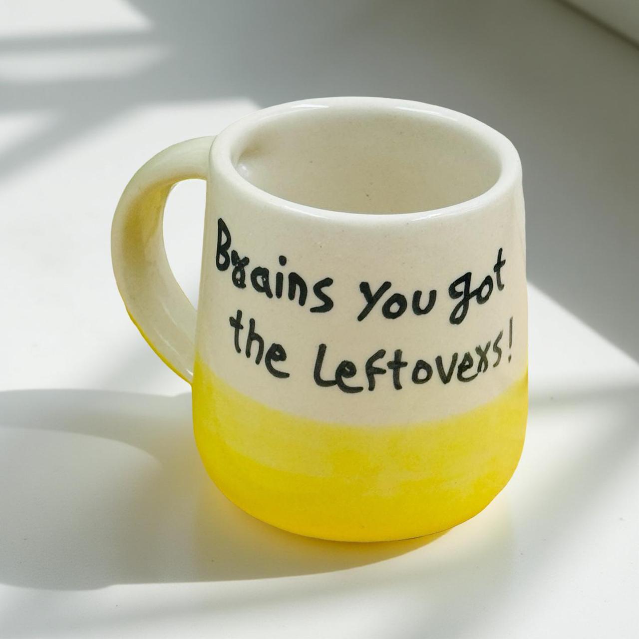 Mug with text 'Brains you got the leftovers!' on a light background