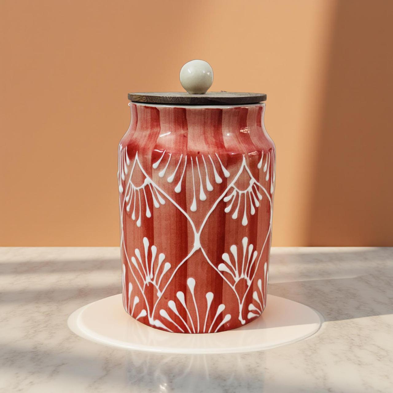 Decorative ceramic jar with white floral patterns on a marble surface with a warm brown background