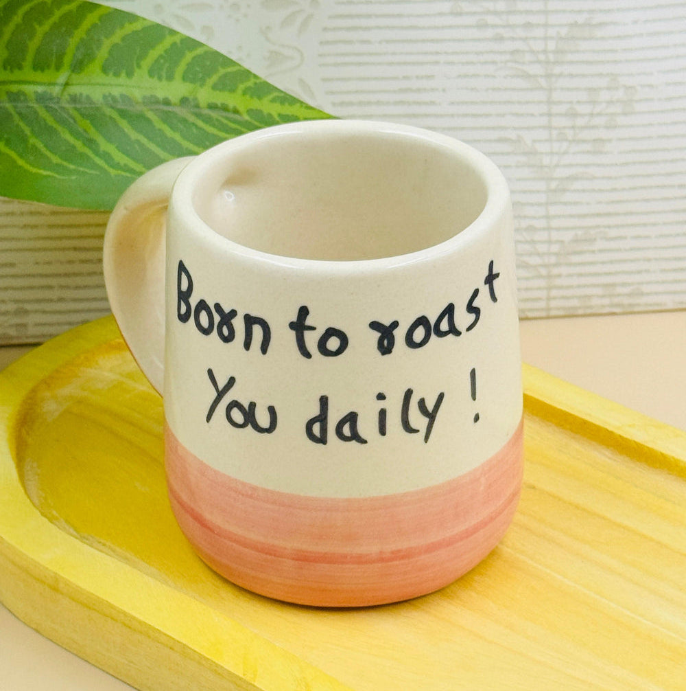 White ceramic mug with the quote “Born to Roast You Daily” in black text – 250 ml, stylish and bold
