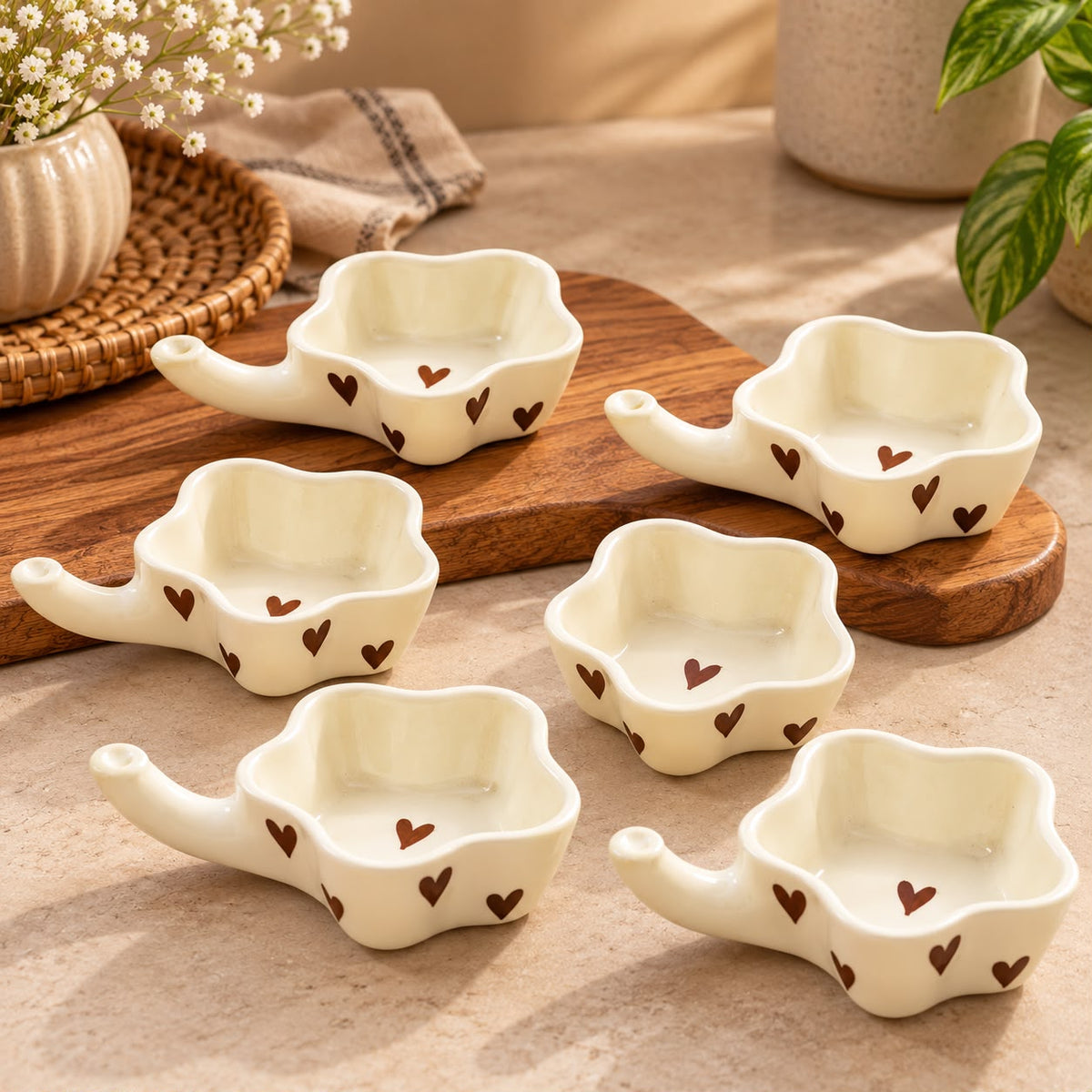 White ceramic dip bowls with black heart designs for chutneys and sauces