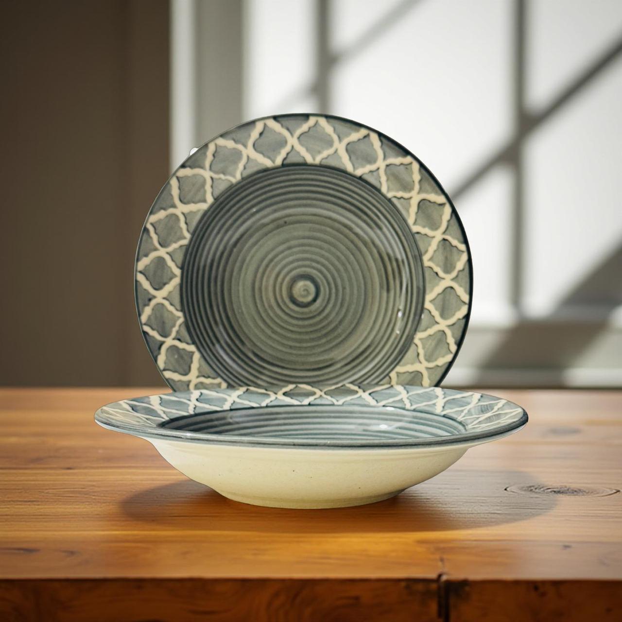 Ceramic bowl and plate with geometric patterns on a wooden surface