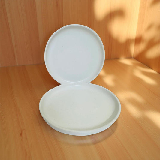White round plates on a wooden surface
