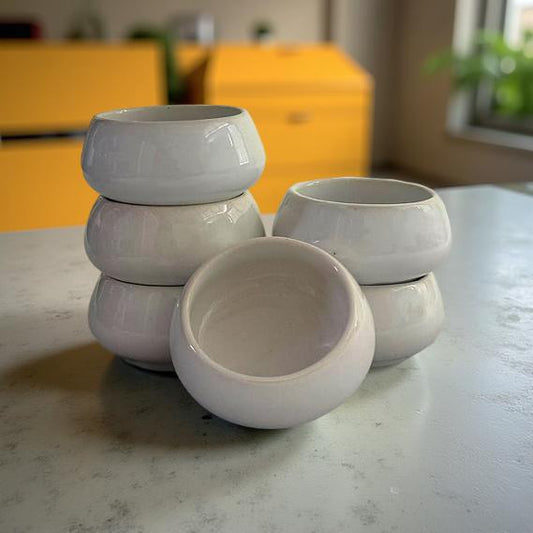 Stacked set of 6 white ceramic chutney bowls on kitchen counter – Lupaava