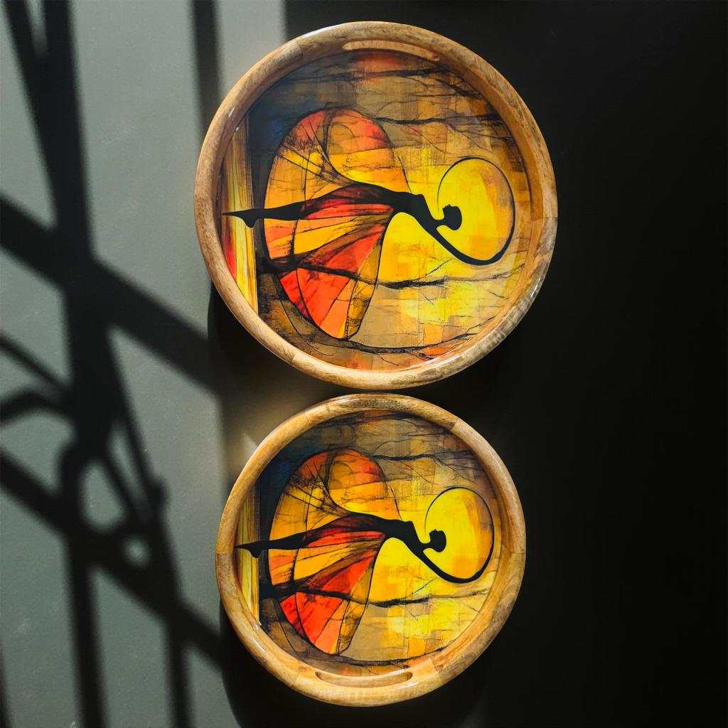 Art-inspired handmade wooden trays with dancer motif and resin coating, ideal for serving and luxury home decor.