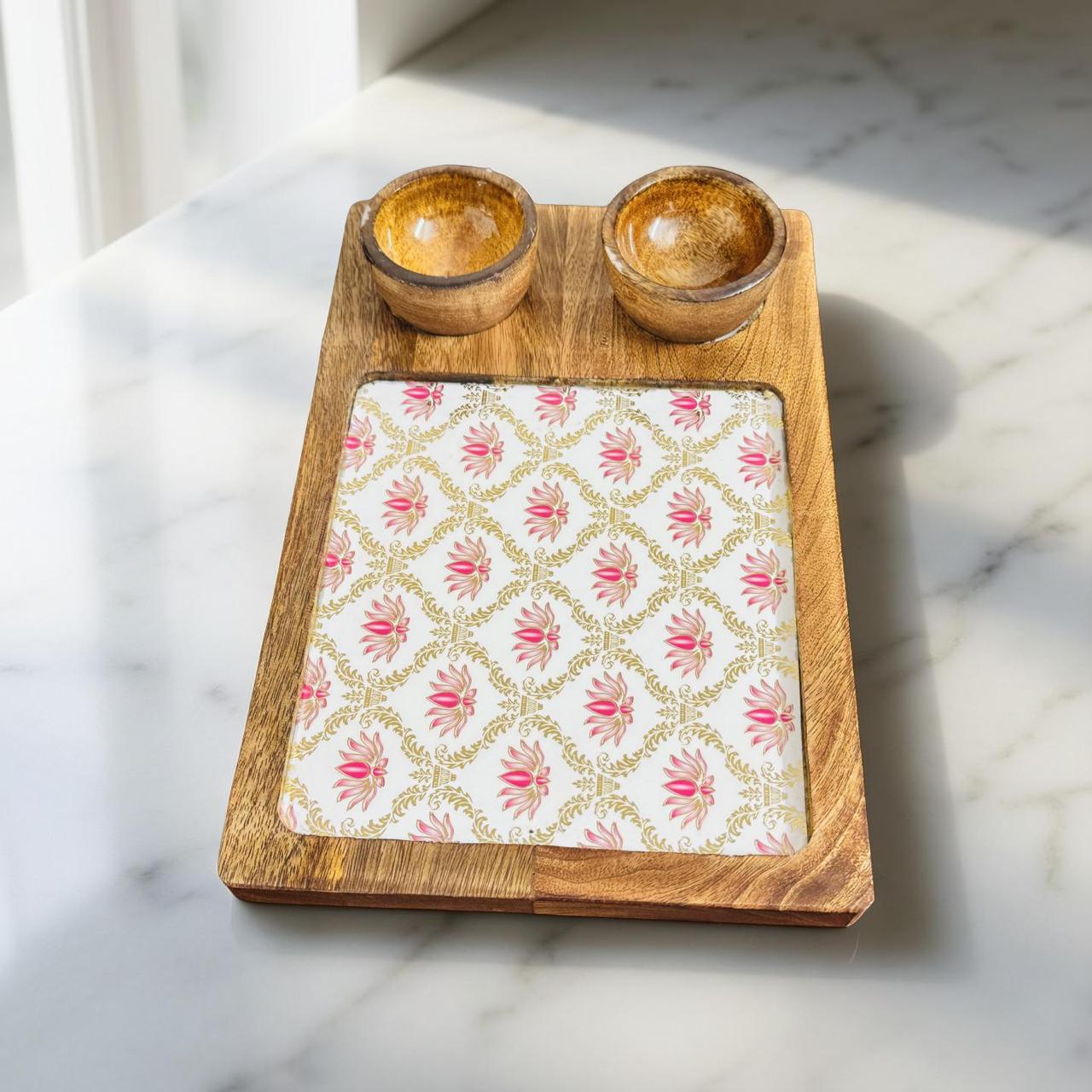 Wooden tray with two small bowls on a marble surface