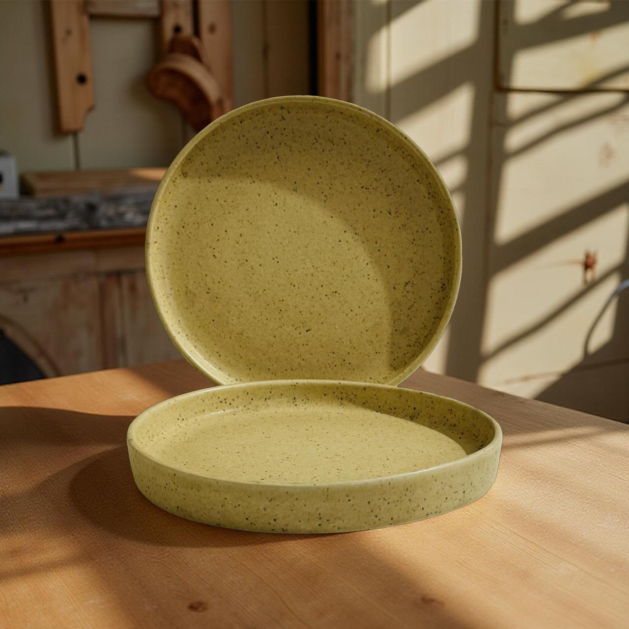 yellow ceramic plates on a wooden surface with a warm, natural light setting.