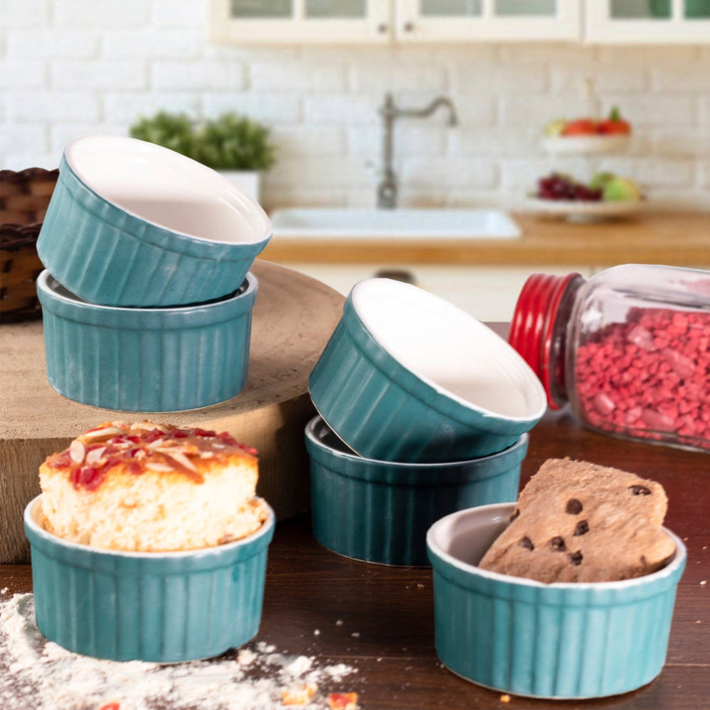 Oven-safe ramekin bowls filled with chocolate souffle