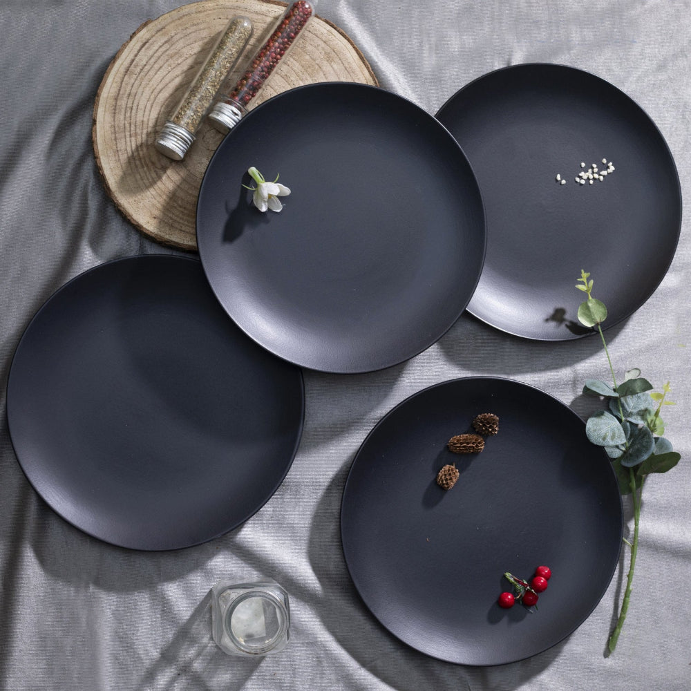 Handcrafted black ceramic plate with food presentation