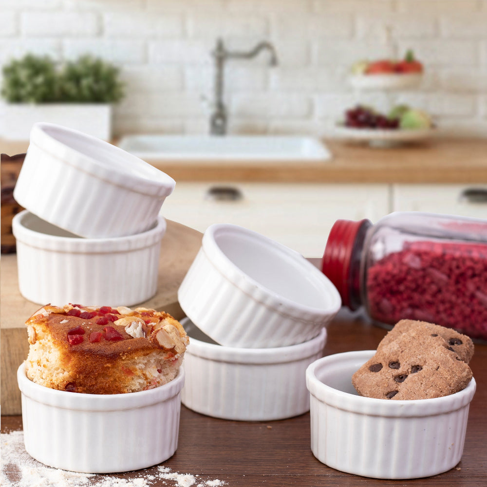 Modern ceramic ramekins next to clean-cut flatware