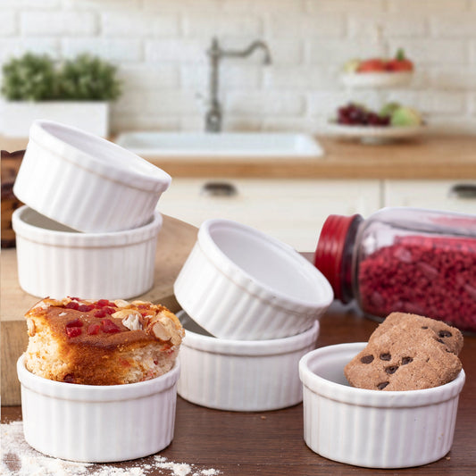 Modern ceramic ramekins next to clean-cut flatware