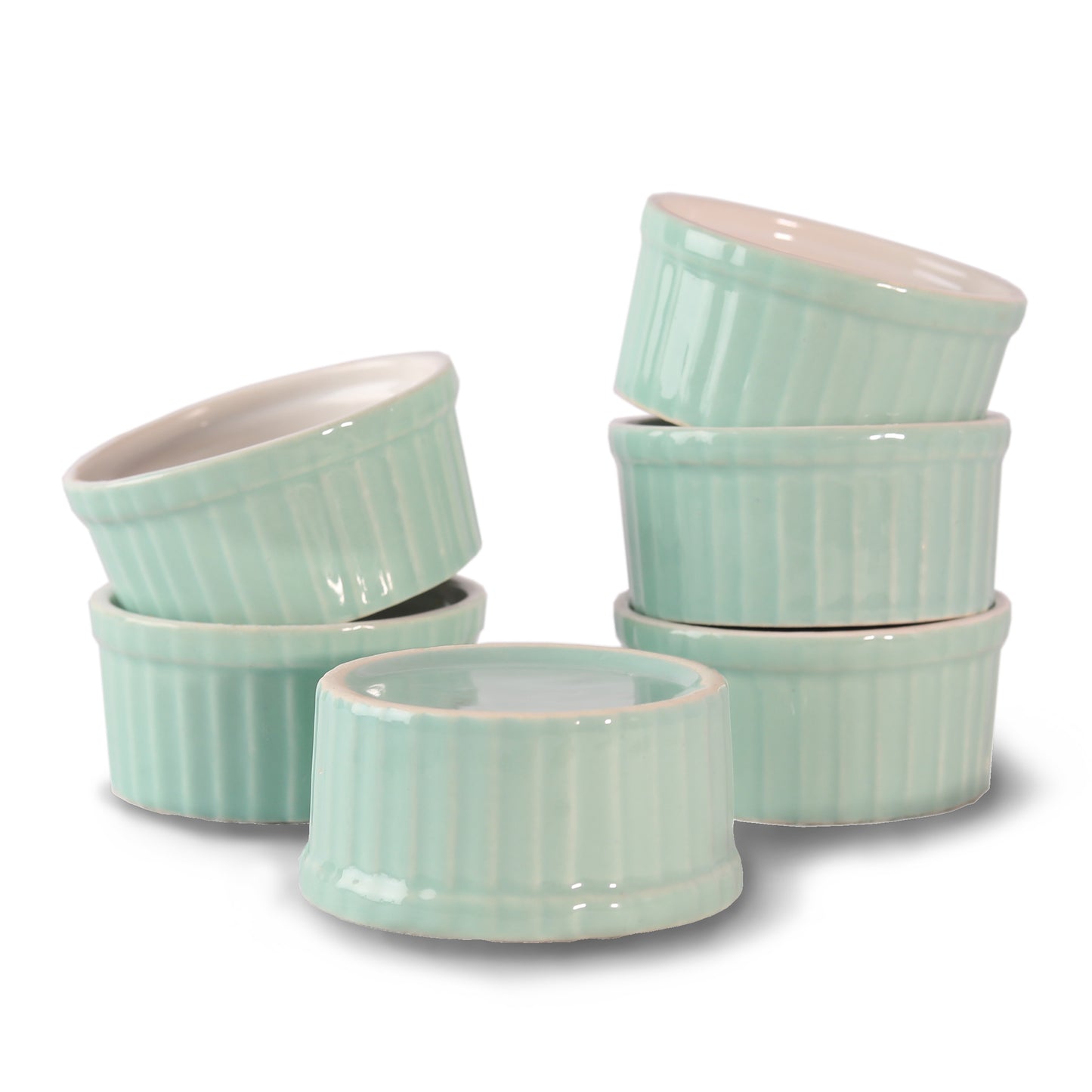 Playful ceramic ramekin bowls in bright colors on kitchen counter