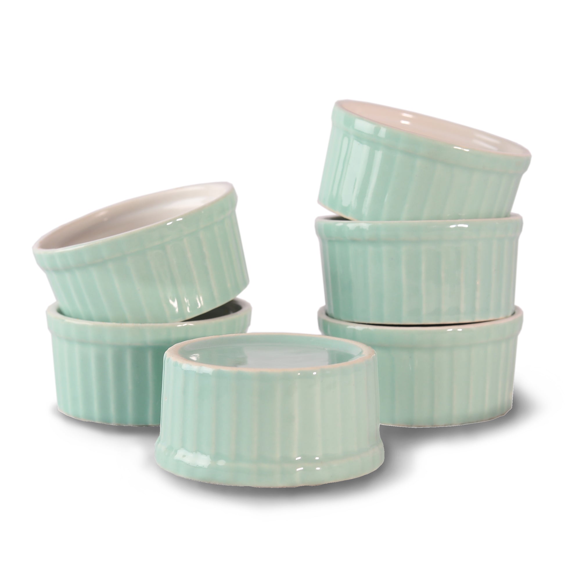 Playful ceramic ramekin bowls in bright colors on kitchen counter