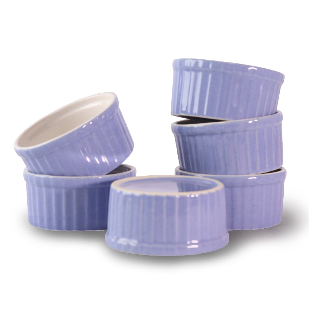 Close-up of handmade pottery ramekins with natural glaze
