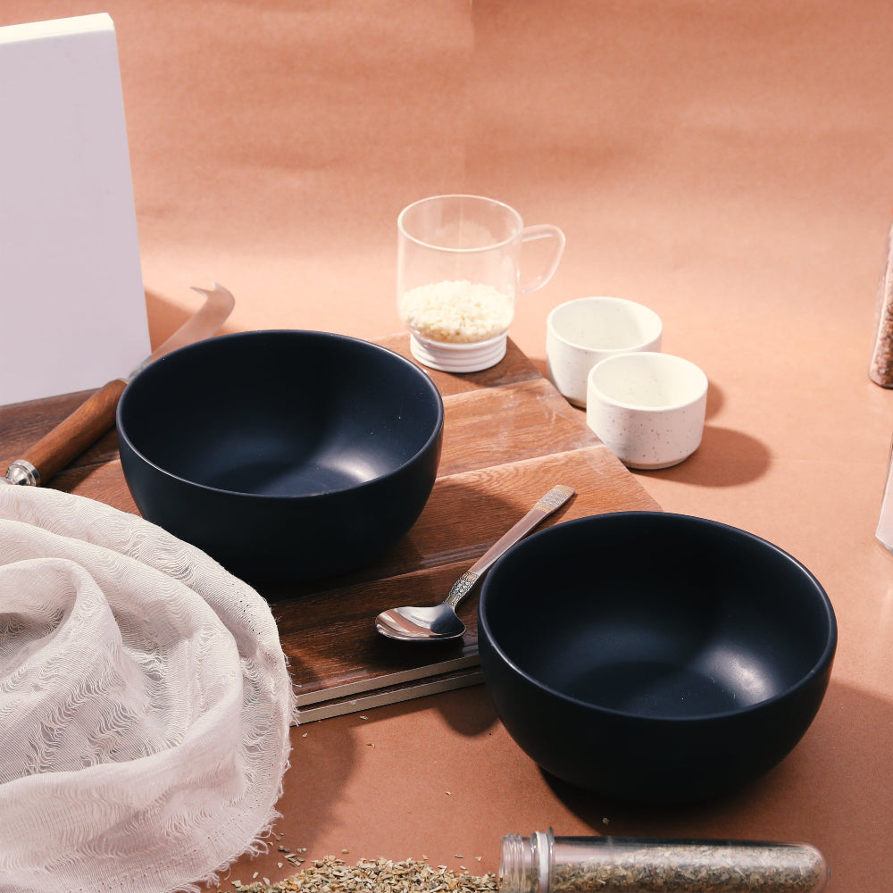 Side view of 6 inch ceramic black bowl with minimalist finish