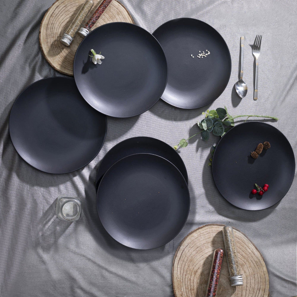 Modern black ceramic plates styled on a dining table